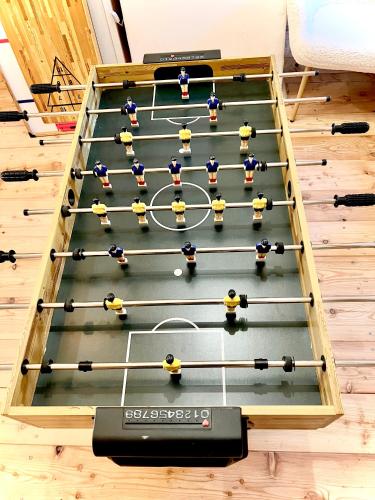a game of volleyball in a room with a table at Santova roubenka in Štramberk