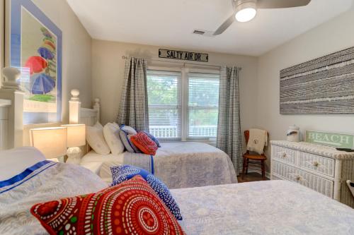 a bedroom with two beds and a window at 3009 Cameron in Isle of Palms