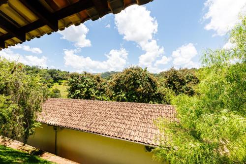 a roof of a building with trees in the background at Hotel Morro De Santo Agostinho in Serra Negra