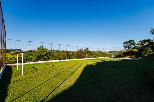a soccer field with a goal in the grass at Hotel Morro De Santo Agostinho in Serra Negra