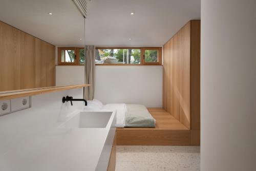 a bedroom with a bed and a sink in a room at Villa Liore in Marina