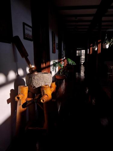 a dark room with a skateboard on the wall at La Estancia Hotel Boutique in Salamina