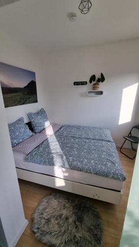 Ένα ή περισσότερα κρεβάτια σε δωμάτιο στο Ferienwohnung Talblick