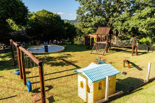 a park with a playground with a play equipment at Hotel Morro De Santo Agostinho in Serra Negra