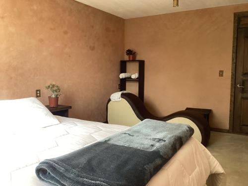 Cama o camas de una habitación en Hotel las carretas , spa y temazcal