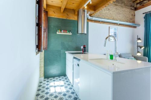 a kitchen with a sink and a counter top at Mediterranean Gem Getaway in Valencia