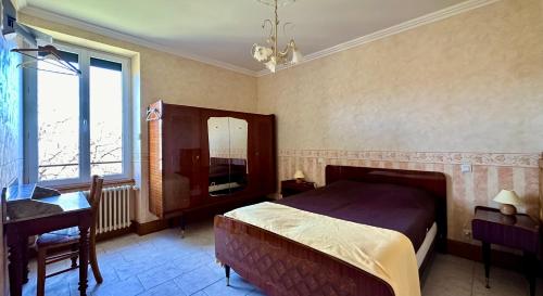 A bed or beds in a room at Domaine Bois De Capy