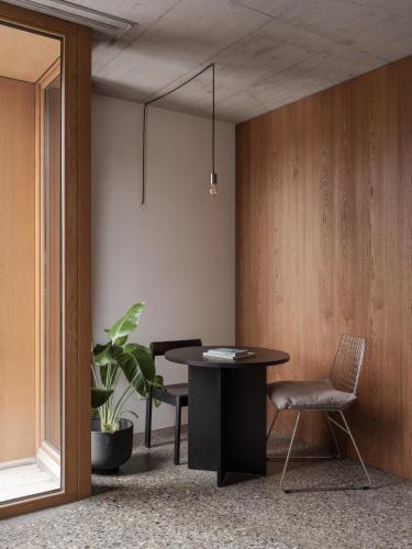 a dining room with a table and a chair at ArtBau Designhotel in Waldkirch