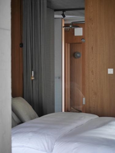 a close up of a bed in a bedroom at ArtBau Designhotel in Waldkirch