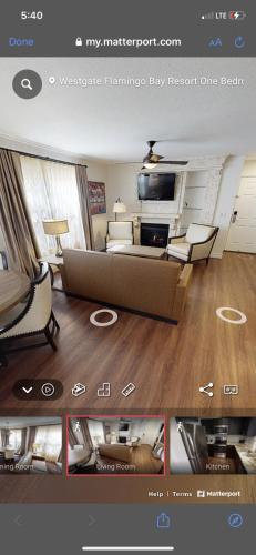Captura de pantalla de una sala de estar con sofá y sillas en Westgate Flamingo Bay Resort en Las Vegas