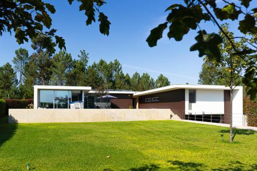 a house with a lawn in front of it at Exclusive Villa & SPA - by Proguest in Vila Verde