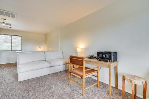 a living room with a couch and a table with a microwave at Gorgeous Green Valley Home Patio and Private Pool! in Green Valley