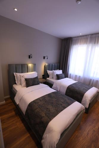 Cama o camas de una habitación en Dallga Suites