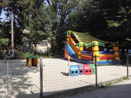 a playground with a slide in a park at Delice in Lviv