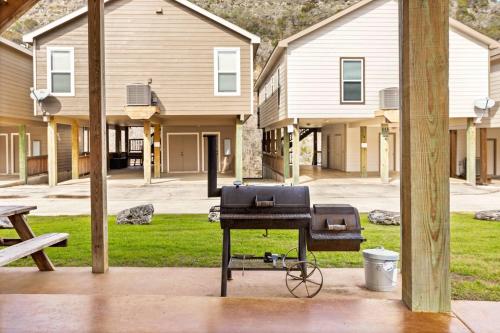 a bbq grill on a table in front of houses at Cliff View #14 in New Braunfels