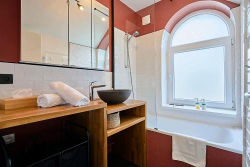a bathroom with a sink and a window at Maison Croix centre in Croix