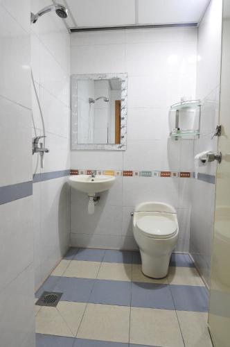 a bathroom with a toilet and a sink at Hotel China Town 2 in Kuala Lumpur