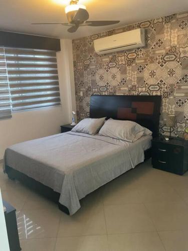 Кровать или кровати в номере Villa-Portal al Sol, vía a la Costa, Guayaquil-EC