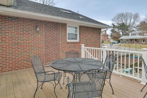 a patio with a table and chairs on a deck at Large Home with Deck and Grill about 9 Mi to Virginia Tech in Christiansburg