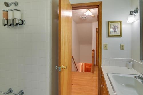 a bathroom with a tub and a sink at Large Home with Deck and Grill about 9 Mi to Virginia Tech in Christiansburg