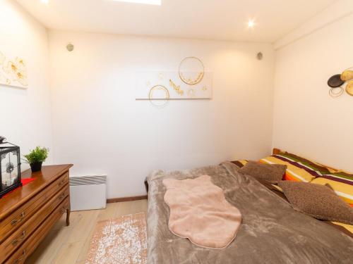 a bedroom with a bed and a tv at Charming Family Home in Esneux in Esneux