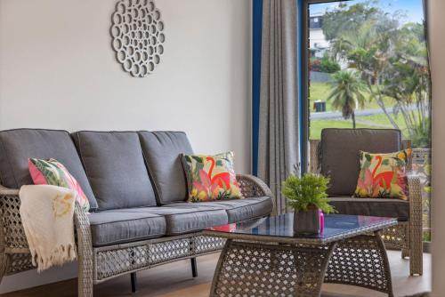 a living room with a couch and a table at Sea Tonic on Market in Woolgoolga