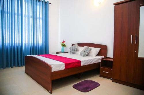 מיטה או מיטות בחדר ב-Ayo Villa Gurudeniya, Kandy