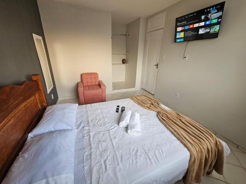 מיטה או מיטות בחדר ב-Apto novo, mobiliado e acochegante