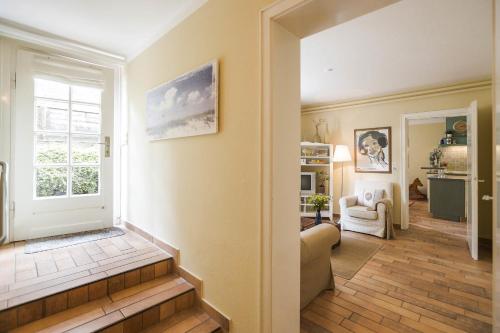a living room with a couch and a window at Immenhof in Flensburg