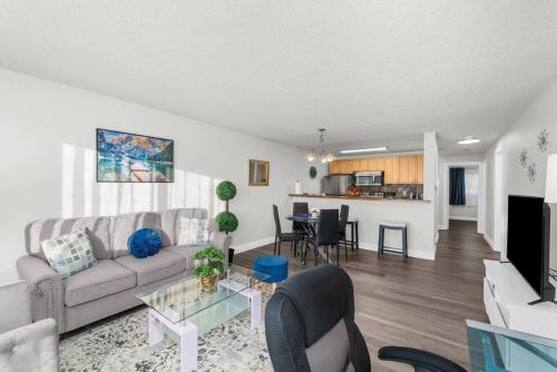 a living room with a couch and a table at Casa Bella Homes - Top floor 2-BR 1 Bath Condo, Centrally located in Federal Way