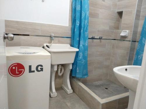 a bathroom with a sink and a toilet and a shower at LA CASA DE LA ABUELA in Barranca