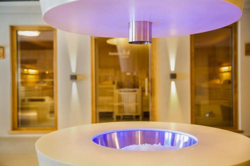a purple light on top of a white table at Familien- und Wellnesshotel "Viktoria" in Oberstdorf