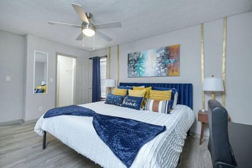 a bedroom with a bed and a ceiling fan at 2BD/2BA - Walk to *The Battery ATL* w/Free Parking in Atlanta