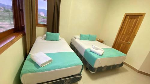 Кровать или кровати в номере Apartamento de PATTY