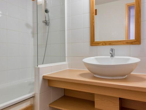 a bathroom with a sink and a mirror at Appartement La Plagne-Tarentaise, 2 pièces, 5 personnes - FR-1-351-163 in La Plagne Tarentaise