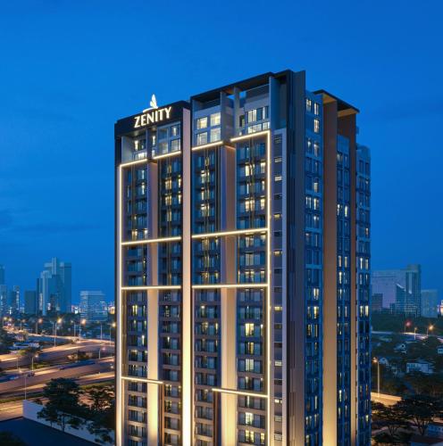 a tall building with a sign on top of it at Luxury 2 or 3BR Apartment in Dist 1, Pool and airport pickup in Ho Chi Minh City