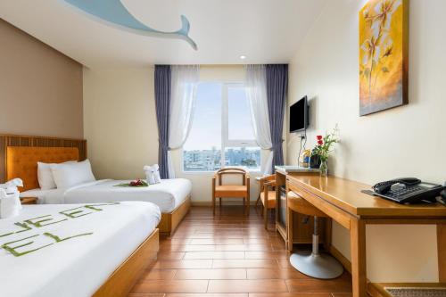 Кровать или кровати в номере SEA QUEEN Hotel
