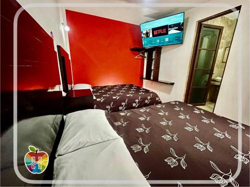 Voodi või voodid majutusasutuse HOTEL LA GRAN MANZANA toas