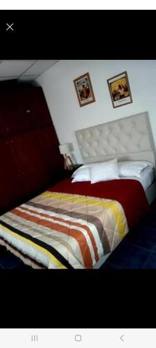 En eller flere senge i et værelse på Güemes