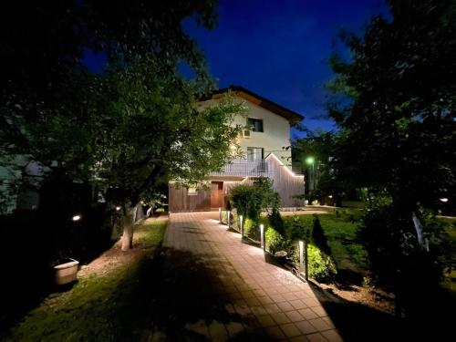 a house at night with a walkway in front at Villa BB in Sarajevo