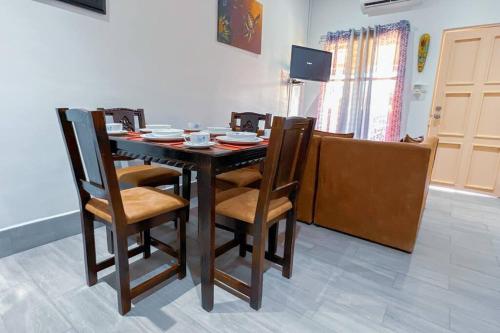 a dining room with a table and chairs at Villa Paraíso banano 9, near to the beach & Pool in Jacó