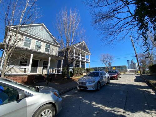 two cars parked in front of a house at Entire Home Downtown ATL! Walk to GWCC and more! in Atlanta
