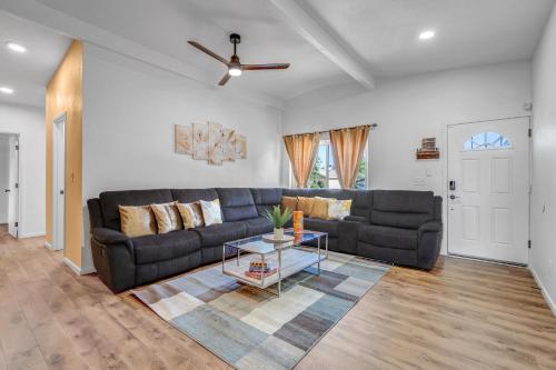 a living room with a couch and a table at Spacious Remodeled Retreat Haven in Las Vegas