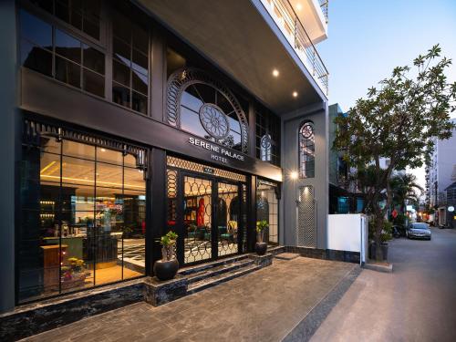 a store front of a building with a clock on it at Hue Serene Palace Hotel in Hue