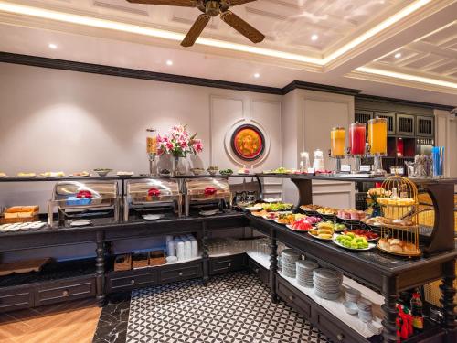 a buffet line with many different types of food at Hue Serene Palace Hotel in Hue