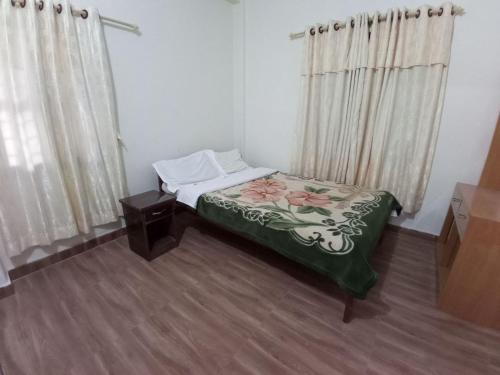 Cama ou camas em um quarto em Fewa Apartment