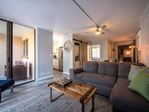 a living room with a couch and a table at Maui Makai Condo - Completely renovated 1 bedroom 1 bath condo, just steps away from Kahana Beach in Kahana