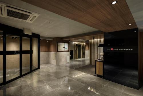 a lobby of a building with a television in it at the b osaka-shinsekai in Osaka