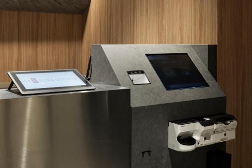 a cash register with a laptop on top of it at the b osaka-shinsekai in Osaka