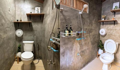 La salle de bains est pourvue d'une douche, de toilettes et d'un lavabo. dans l'établissement บ้านพักกึ๊ดเติง แม่กำปอง เชียงใหม่, à Mae On